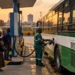 Bus refuelling at a CNG station in Nigeria as commuters wait, illustrating the October 1 CNG transit fare cut programme
