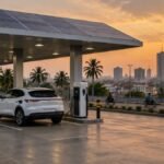 Electric car charging at a solar-powered EV charging and fuel station in Nigeria at dusk
