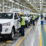 Unbranded vehicles on a local car assembly line in Nigeria